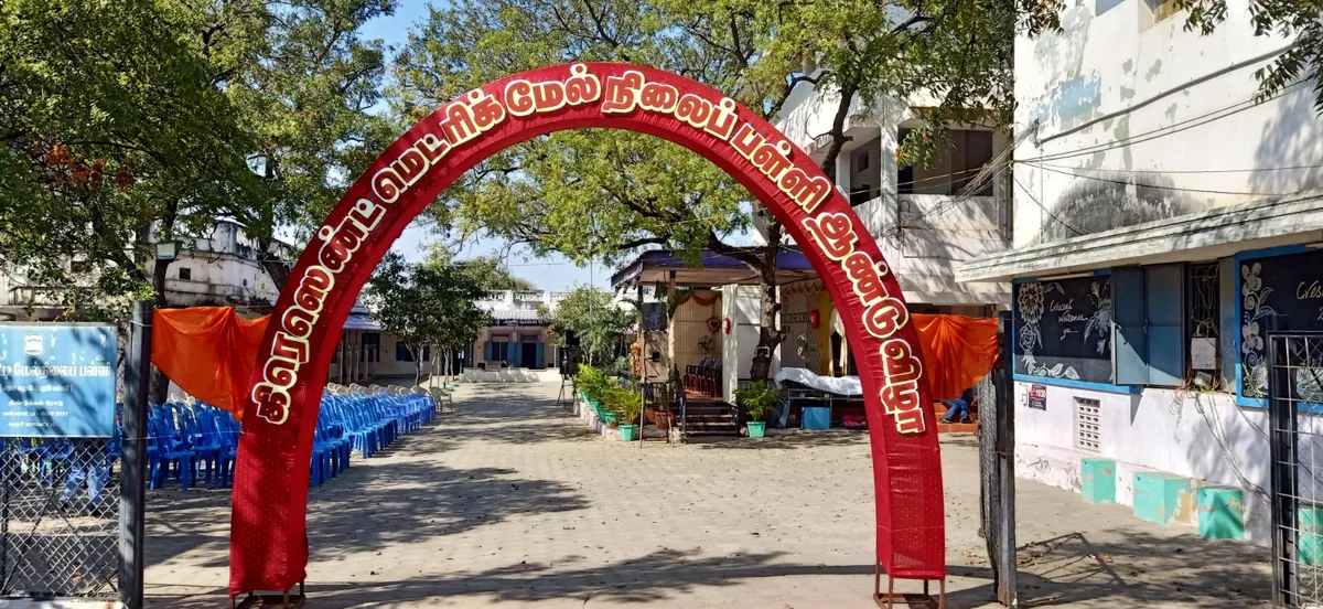 Decorated welcome arch at the Crescent School entrance during a function