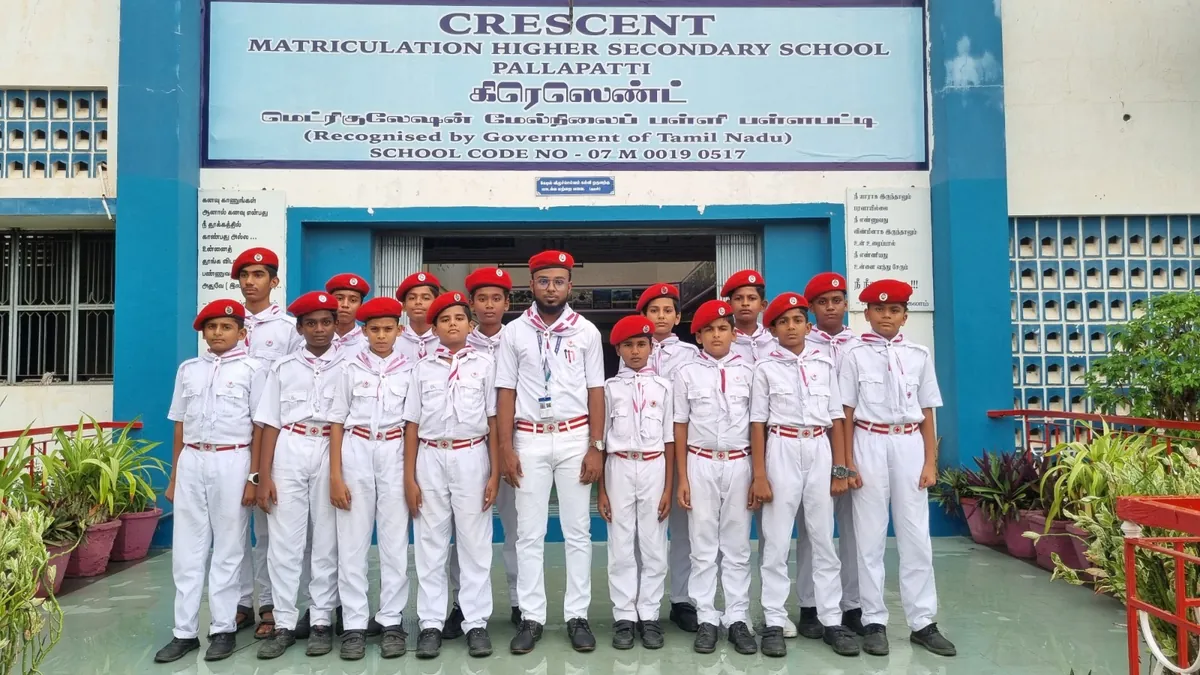 Crescent students assembled beneath the school name board